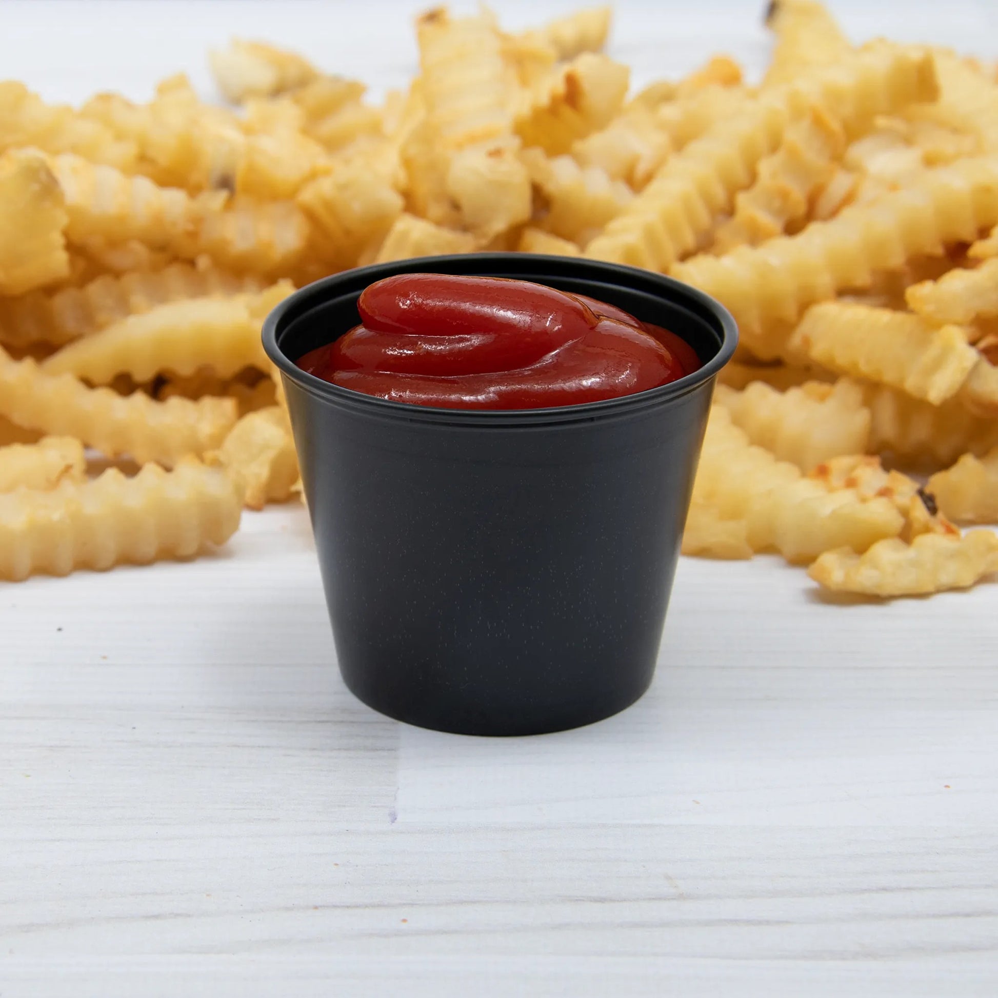 Vasito de Plástico Negro para Salsas y Aderezos, (Soufflé) Marca SOLO® (2,500 pzas.)